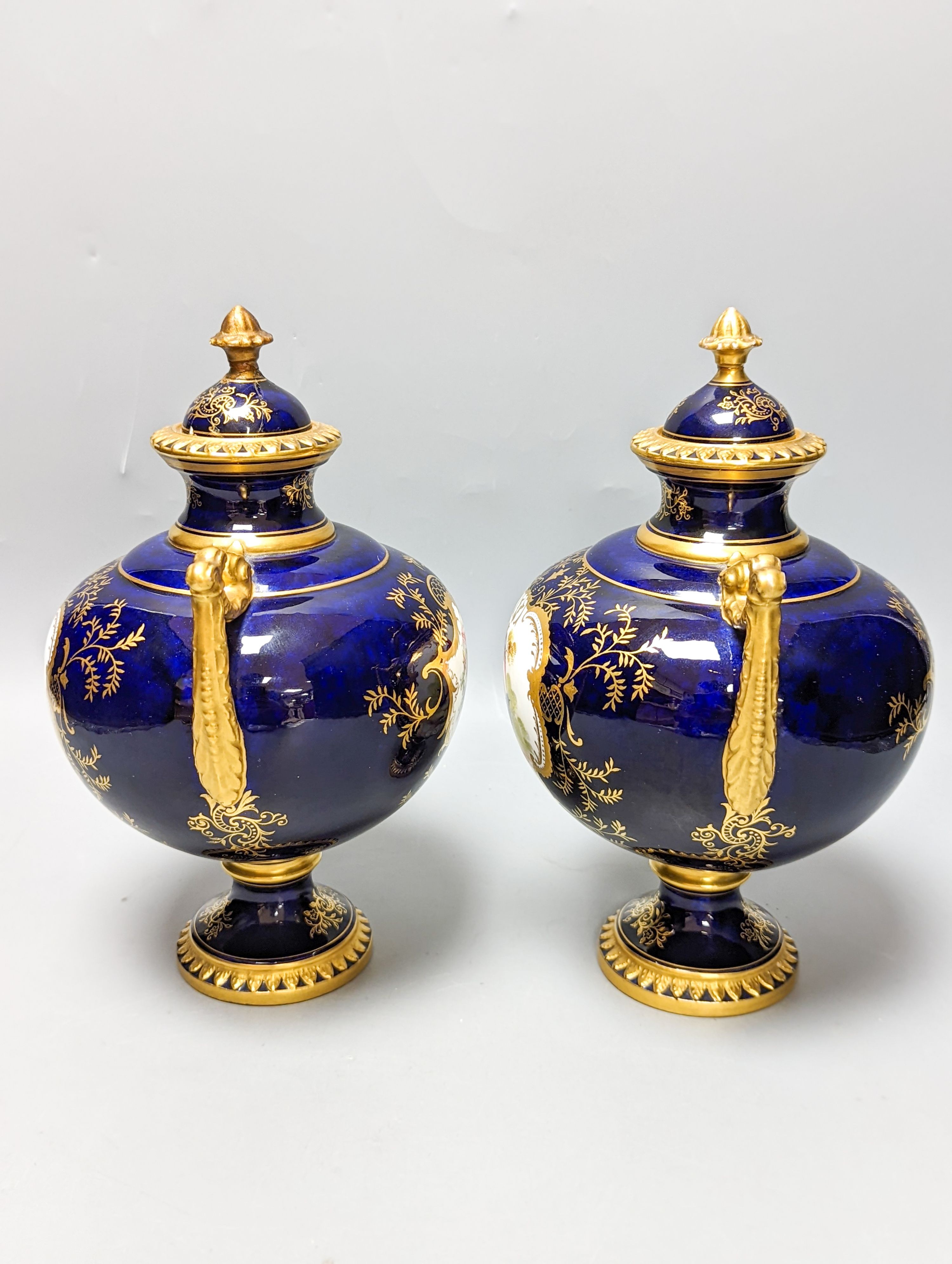 A pair of Coalport bird painted vases and covers, c.1900, inscribed Y.5146 - 22cm